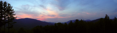 Photo of Sunset with mountains in background