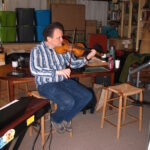 Photo of Eric Ortner Playing Violin in Studio