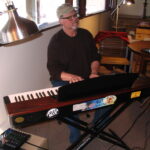 Gary Swanson playing keyboards in studio