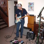 Jim Ianucci playing guitar in studio